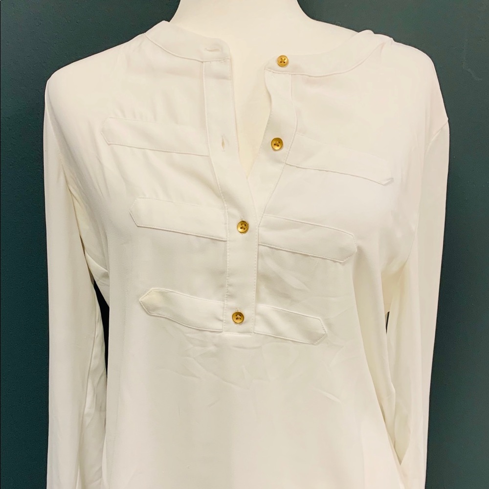 Beautiful white blouse with gold buttons.